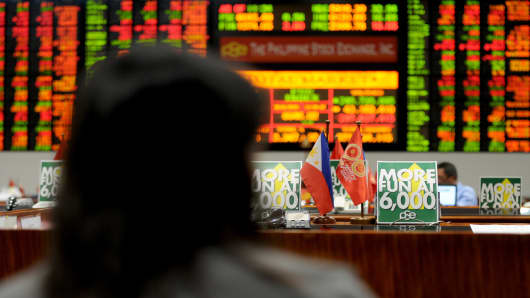 A trader looks at a stocks monitor at the Philippine Stock Exchange in Manila. The market, together with stocks in other emerging markets, were hit hard last week.